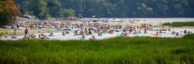 Wausau, Wisconsin, USA - July, 27, 2024: 10th annual paddle pub crawl on Lake Wausau, panorama clipart