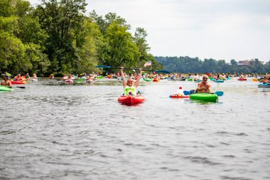 Wausau, Wisconsin, USA - July, 27, 2024: 10th annual paddle pub crawl on Lake Wausau, horizontal clipart