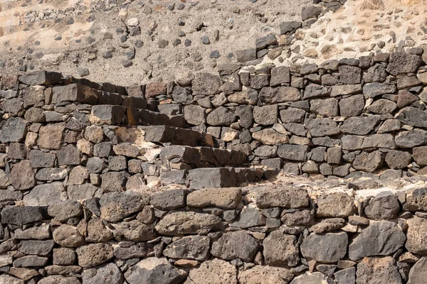 Details of stone stairs of the ruins of a lime kiln. Lime was export product in the history of the island. Hornos de cal de la Hondura, Fuerteventura, Canary Islands, Spain.
