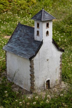 Exact miniature copy of the historical church Pominovec. Miniatures park where are important slovak sights. Podolie, Slovakia. clipart