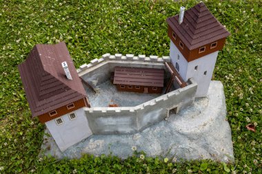 Exact miniature copy of the historical Black Castle. Miniatures park where are important slovak sights. Podolie, Slovakia. clipart