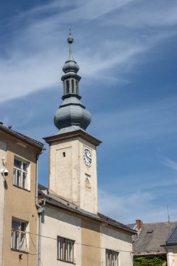 Tower of the old Town hall. Clock on the tower. Blue sky with white clouds. Zabreh, Moravia (Morava), Czech republic. clipart