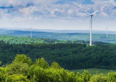landscape wind turbines forest spring sustainability renewable energy saarland nature germany