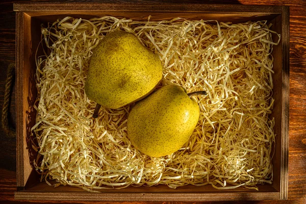 Two Ripe Pears Box Shavings Wooden Table Close Top View — Stockfoto