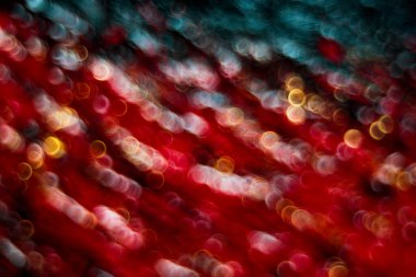 Odaklanmamış ışıklarla soyut kırmızı arkaplan.