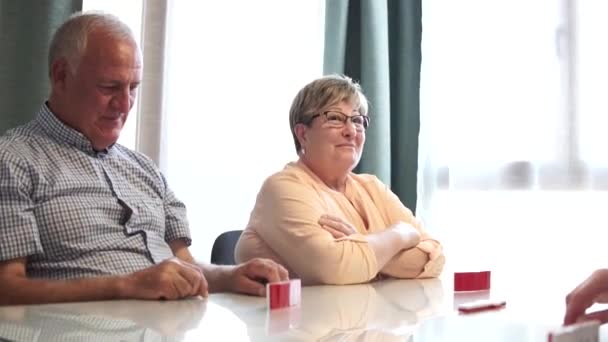 Senior Couple Caucasian Man Woman Laughing Playing Dominoes Concept Friendship — Stock Video