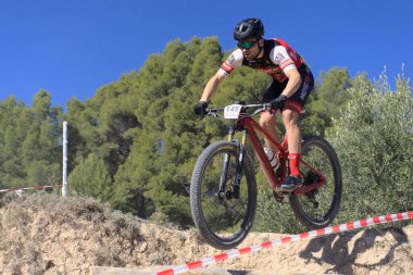 Ibi, Spain - February 5th 2023. Mountain bike rider in urban XCO CUP