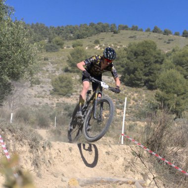 Ibi, Spain - February 5th 2023. Mountain bike rider in urban XCO CUP