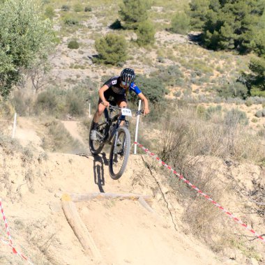 Ibi, Spain - February 5th 2023. Mountain bike rider in urban XCO CUP