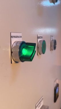 Hand actuate green button power switch off. Turn off cooling electrical equipment in industrial factory. Control Panel end of work. Turn on. 4K 60fps vertical footage. High quality FullHD footage