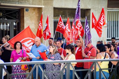 Alicante, Spain - September 26th 2024. Workers demonstrate in front of the employers' headquarters to demand a reduction of the working week to 37.5 hours. Trade unions CCOO and UGT. High quality photo clipart