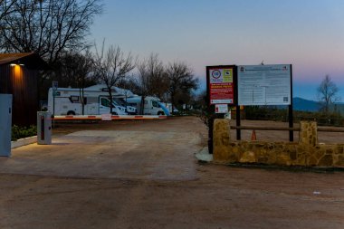 Dona Mencia, Cordoba, Spain - December 27th 2023. Entrance to Public motorhome area next to via verde del aceite.  clipart