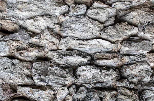Background Texture. Texture of a Stone Wall. Old Castle Stone Wall Texture Background. Stone Wall as a Background or Texture. Part of a Stone Wall, for Background or Texture.