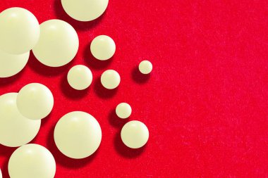 Light Balloons on a Red Background. Abstract Minimal Futuristic Background with Balls. Abstract Marble Balls Isolated on Bright Background.