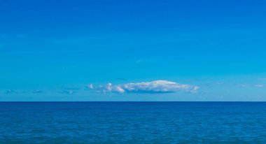 Summer Wave on the Surface of the Fantastic Tyrrhenian Sea. Exotic Water Landscape with Clouds on the Horizon. Natural Tropical Water Paradise. Vacation in Italy. Travel.