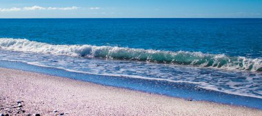 Summer Wave on the Surface of the Fantastic Tyrrhenian Sea. Exotic Water Landscape with Clouds on the Horizon. Natural Tropical Water Paradise. Vacation in Italy. Travel.