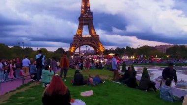 Paris, France, January 28, 2023: Paris, Tourists and Locals are Waiting for the Light Show. Fantastic View of the Glowing Eiffel Tower in Paris Late at Night, France, Europe.