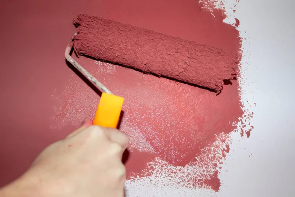 Roller Brush Painting, Working Wall Painting in Home, Office With a Roller Brush for Protection and Interior. Repair in the Room, House.