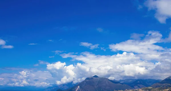 View of Clouds Over the Mountain. High Angle View Blue Sky Over Mountain. View on Mountains. Mountain Sky and Land Landscape.
