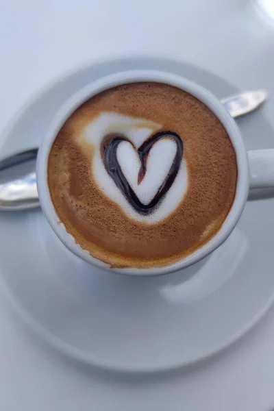 Cup of Coffee with Heart Shape. Hot Latte Coffee Put on Table in Cafe Restaurant, Drink Breakfast in the Morning Day.