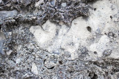 Antik Taş Duvar. Soyut Çimento Arkaplanı. Çakıl taşlarından, taşlardan ve tuğlalardan oluşan antik taşın dokusu..