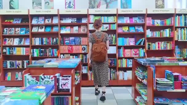 Kyiv Ukraine July 2023 Young Woman Bookstore Beautiful Girl Looking — Stock Video