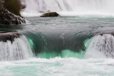 Waterfall on mountain river with clear turquoise water, National Park Una clipart