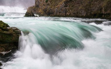 Waterfall and cascade on Una river, water sprays and flows in motion blur, turquoise colour clipart