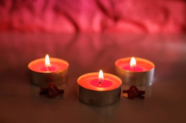 Burning Romantic Candlelight On red Background. clipart