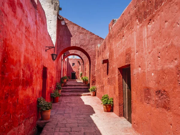Stunning architectures of the ancient Santa Catalina monastery with bright red walls, Arequipa, Peru