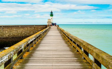 The Le Treport lighthouse is a cylindrical tower, 14 meters high and painted white and green. It is located at the end of the west pier of the town of Le Treport, signaling the entrance to the port clipart