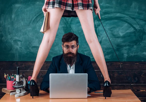 stock image Sexy teacher and sensual schoolgirl student, education for adult. Back to school. Sexy student schoolgirl with short school girl skirt seduction surprised teacher in classroom. Romantic lovers