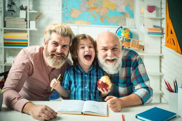 Grandfather father and son, men in different ages ready to study. Happy family at school. Three men generation. Knowledge and education concept