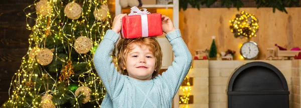 Funny Child Holding Red Gift Box Both Hands Christmas Celebration — Stock Photo, Image