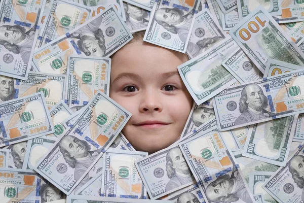 Head in money. Fun kid face on dollars money. Shopping and financial concept