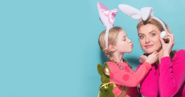 Daughter kiss her mother for Easter, isolated. Horizontal photo banner for website header design