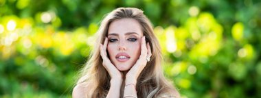 Woman beauty face. Spring banner website header. Summer model. Close up portrait of beautiful woman. Beautiful young girl in summer park outdoor. Pretty girl model on summer background