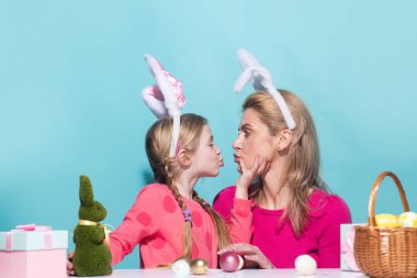 Family easter. Ester for mother and daughter. Mom with daughter kissing. Mother and child wearing bunny ears. Easter banner, poster flyer header for website template