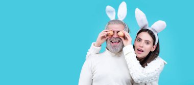 Easter couple. Smiling happy spring couple looking camera. Wide photo banner for website header design