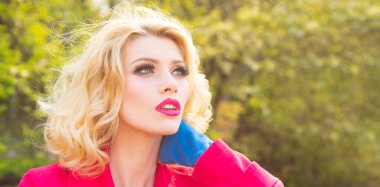 Portrait of sensual woman in spring background. Banner for website header. Young woman over spring garden background. Woman with spring blooming flowers