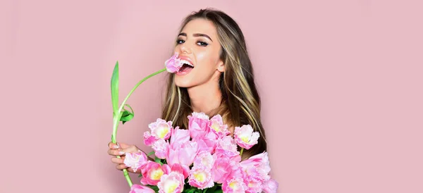 Happy spring young woman with tulips flowers. Sensual spring woman in studio, banner for website header