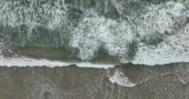 Waters of the ocean, swirl on the beach and scenic coastline. 4K Aerial view top view drone move Beautiful topical beach. Top view beach. Flying by drone, top aerial view