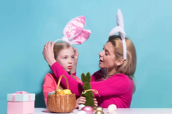 Family easter. Mom with child are preparing for Easter. Mother and daughter wearing bunny ears. Easter banner, mockup copy space, poster flyer header for website template