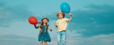Kids having fun in autumn against blue sky. Child playing Happy childhood. Childhood on countryside. Spring and kid. Wide photo banner for website header