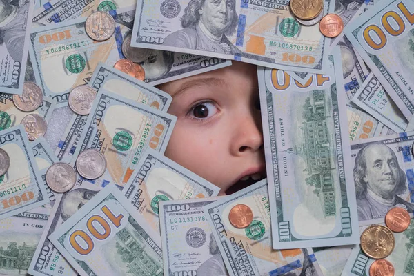 Head in money. Fun kid face on dollars money