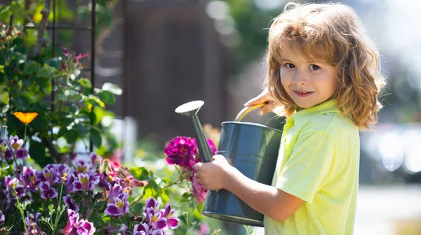 Kid with watering can, spring banner. American kids childhood. Child watering flowers in garden. Home gardening.
