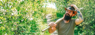 Farmer man on sprin banner. Farmer caring plants. Spring and hobbies. Farmer working on field. Farming