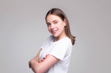 Portrait of happy smiling girl. Cheerful young beautiful girl smiling laughing, studio isoalted background