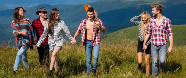 Group of friends tourists, spring banner. Friends camping. Weekend hike. People enjoying picnic on sunny day. Summer vacations