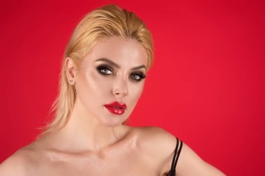 Eyes make up, red lipstick on plump lips. Portrait of beautiful young woman with hairstyle. Closeup photo of amazing hairdo lady, isolated studio background. Portrait of caucasian female model